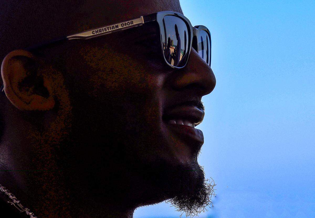 Mikerlange Barthélemy, Haitian-born equestrian trainer from Wellington enjoys the World Polo League season finale on Sunday, April 23, 2023 in Miami Beach, Florida.