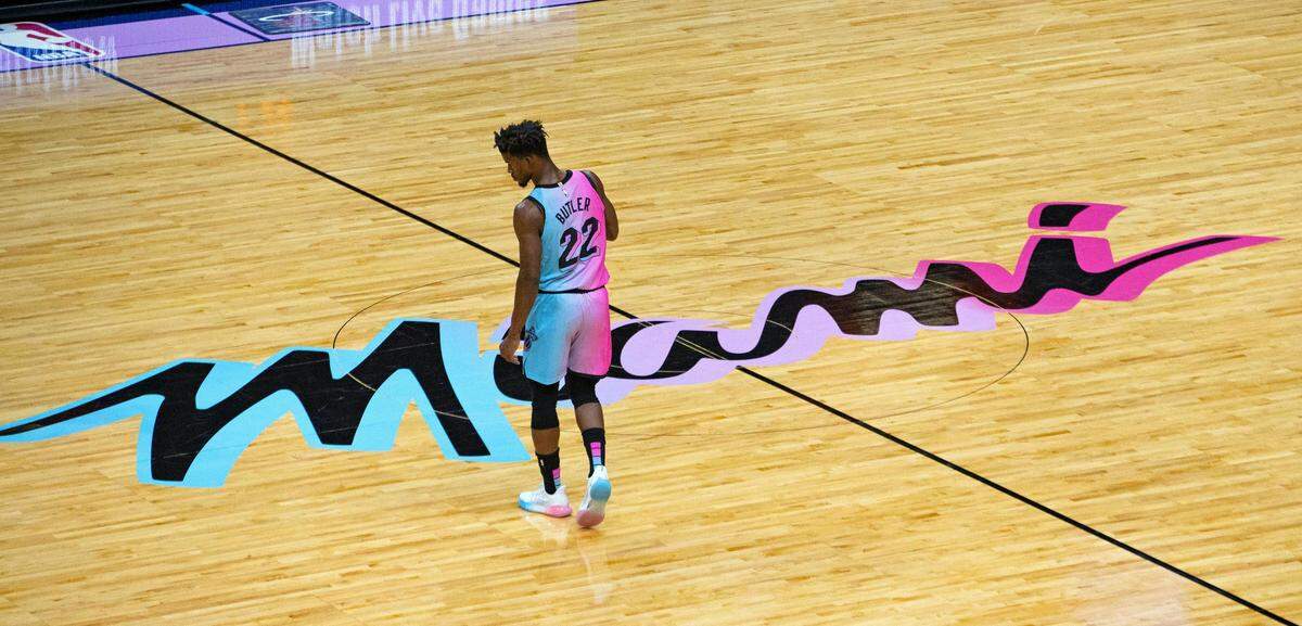 A view of the Miami Heat ViceVersa logo as Heat forward Jimmy Butler (22) looks on in the first quarter of a NBA basketball game against the Boston Celtics at the AmericanAirlines Arena on Wednesday, January 6, 2021.