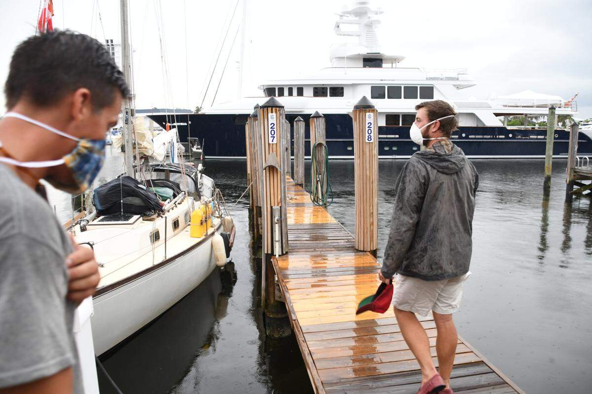 Kennon Jones and Eric Bihl arrive at the Hall of Fame Marina in Fort Lauderdale on Thursday, June 18, 2020.