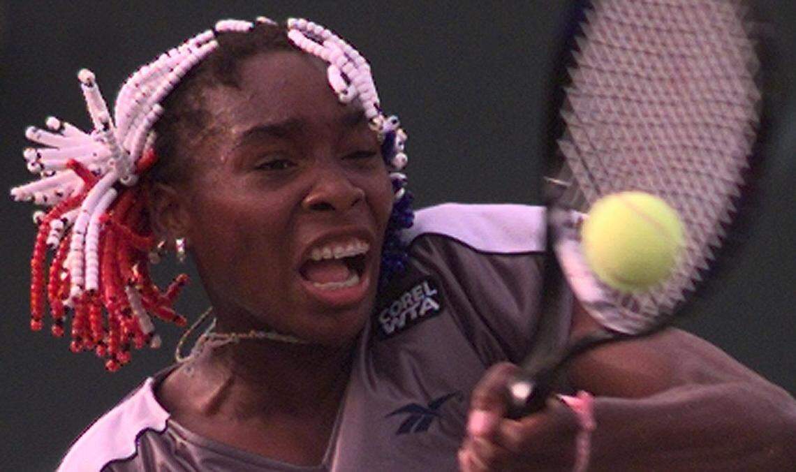 In 1997 at the Lipton, Venus Williams returns a volley vs. Martina Hingis.