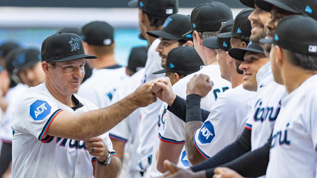 Miami Marlins manager Clayton McCullough (86) fist-bumps players during Opening Day ceremonies prior to the start of their MLB game against the Pittsburgh Pirates at loanDepot park on Thursday, March 27, 2025, in Miami, Fla.