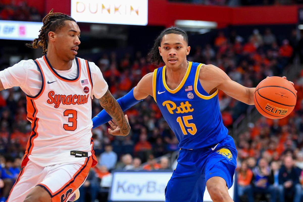 Pittsburgh guard Jaland Lowe (15) drives against Syracuse guard Lucas Taylor (3) during the first half of a game on Jan. 25, 2025, at the JMA Wireless Dome in Syracuse, New York.