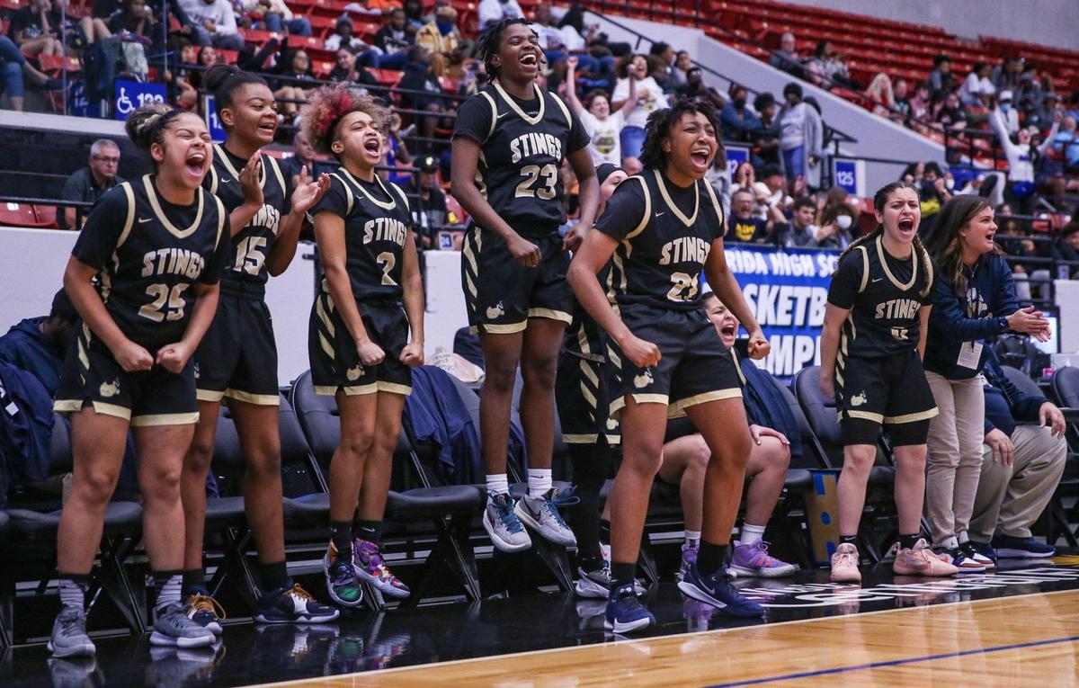 Miami High players react from the bench after the team scores against Colonial in a Class 7A girls basketball state semifinal.RP Funding Center in Lakeland on Friday, February 25, 2022.
