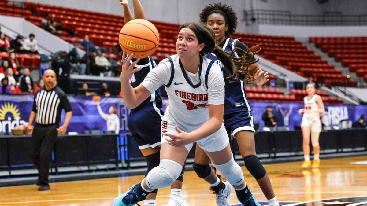 Doral Academy’s Stephanie Vega (24)drives to the basket against Dr. Phillips High School in the second half of the Class 7A semi-final for Girls High School Basketball State Championship at the RP Funding Center in Lakeland, Florida on Friday, March 7, 2025. 