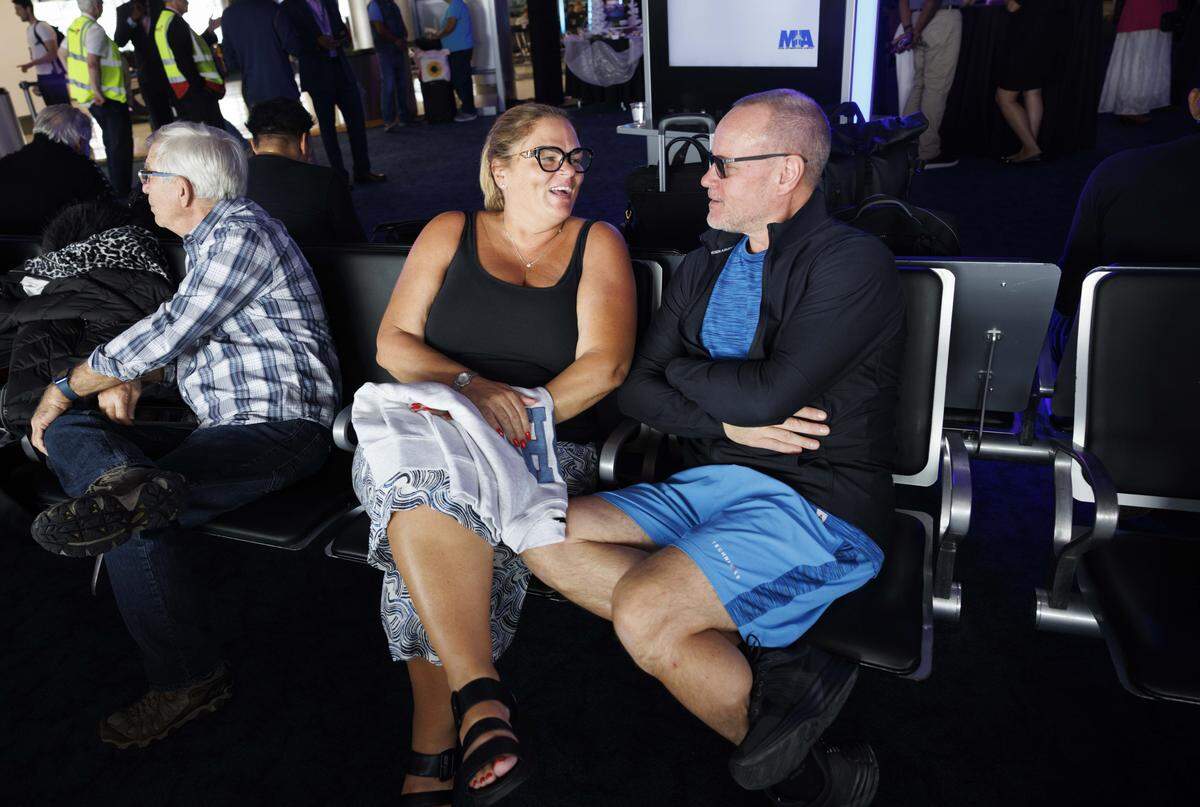 Maureen and John Saxby wait for their flight on Icelandair during a ceremony introducing the only direct flight between Miami and Iceland on Sunday, Oct. 26, 2025, at Miami International Airport in Miami, Fla.