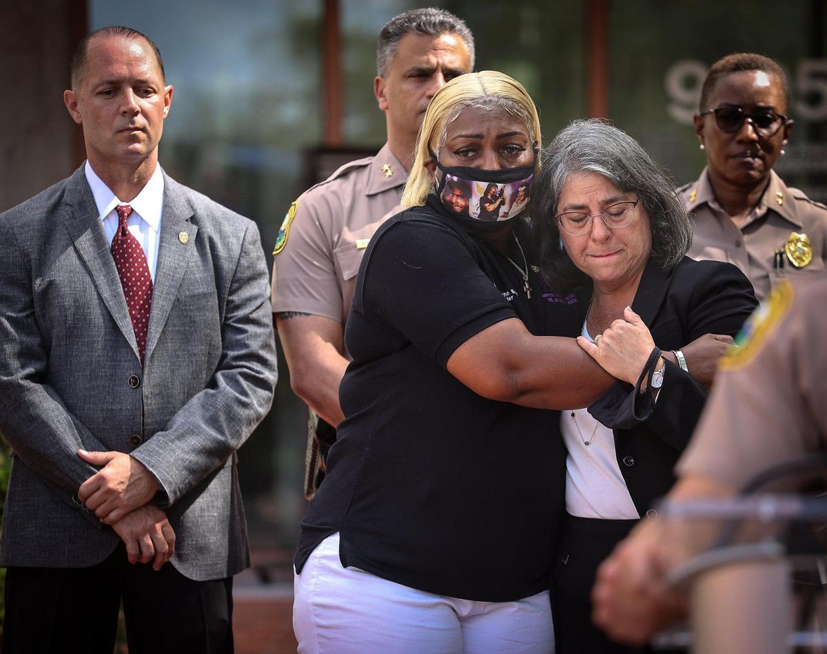 Survivors Affected by Violence The Jack Brown III Foundation founder, Leatha Bush, center, embraces Miami-Dade County Mayor Daniella Levine Cava, right, during the emotional press conference about the Memorial Day weekend mass shootings. Monday, May 31, at the Fred Taylor Miami-Dade Police Headquarters in Doral.