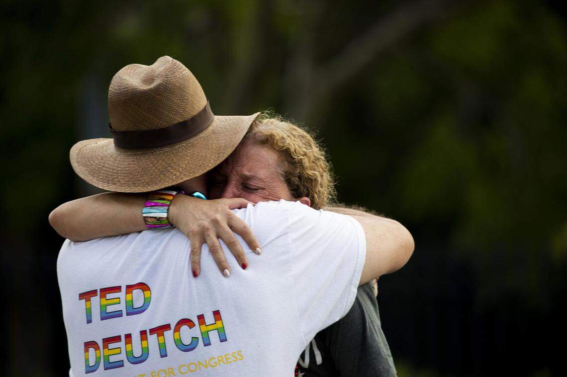 Rep. Debbie Wasserman Schultz, D-Fla., is comforted after a truck drove into a crowd of people during The Stonewall Pride Parade and Street Festival in Wilton Manors, Fla., Saturday, June 19, 2021. A driver has slammed into spectators at the start of a Pride parade in South Florida, injuring at least two people. Wilton Manors police tweeted Saturday night that the parade was canceled due to a “tragic event.”