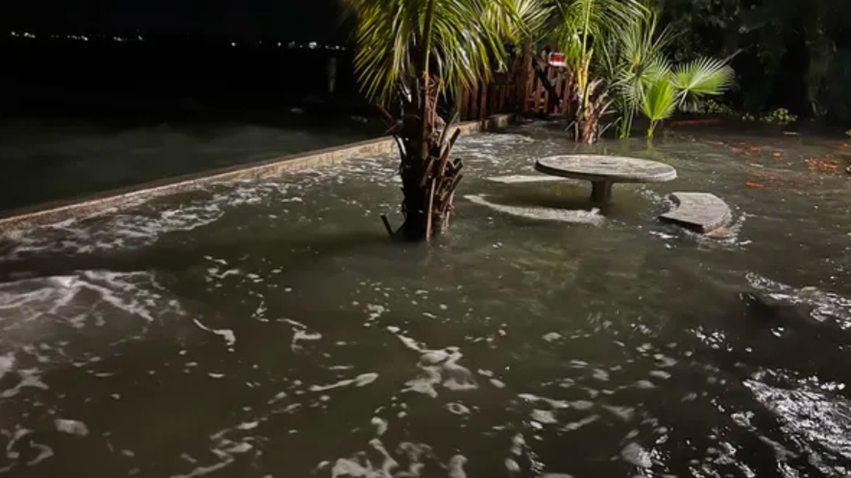 Flooding comes in over the seawall outside an apartment complex off Pass-a-Grille Way.