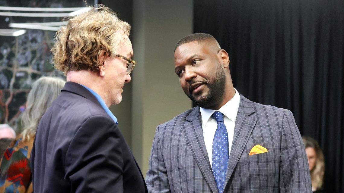 Central Florida Tourism Oversight District Administrator Glenton “Glen” Gilzean, right, talks with Disney historian Rick Foglesong during a board meeting in Lake Buena Vista, Florida, Wednesday, June 21, 2023.