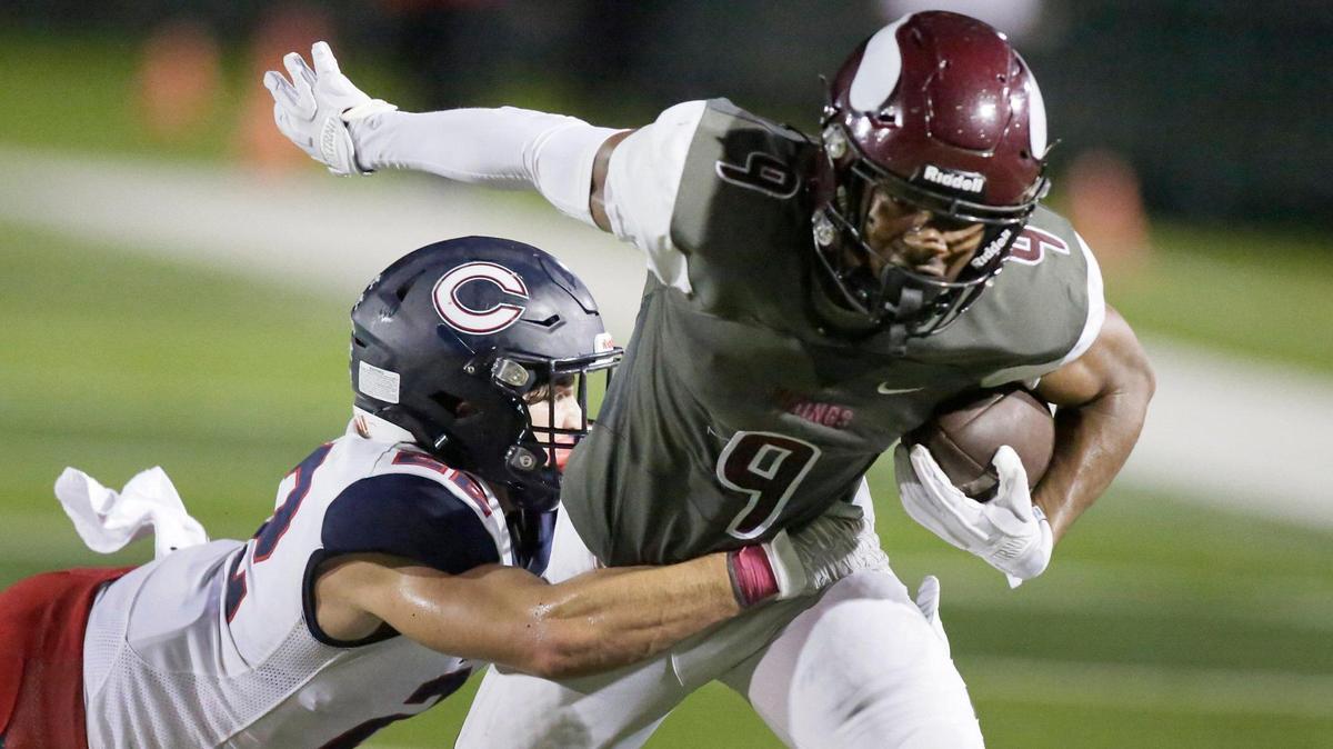 Norland Vikings wide receiver Isaiah Scott (9) tries to break free from Columbus Explorers defender during the football game on Friday, October 20, 2023 at Traz Povewll Stadium in Miami.