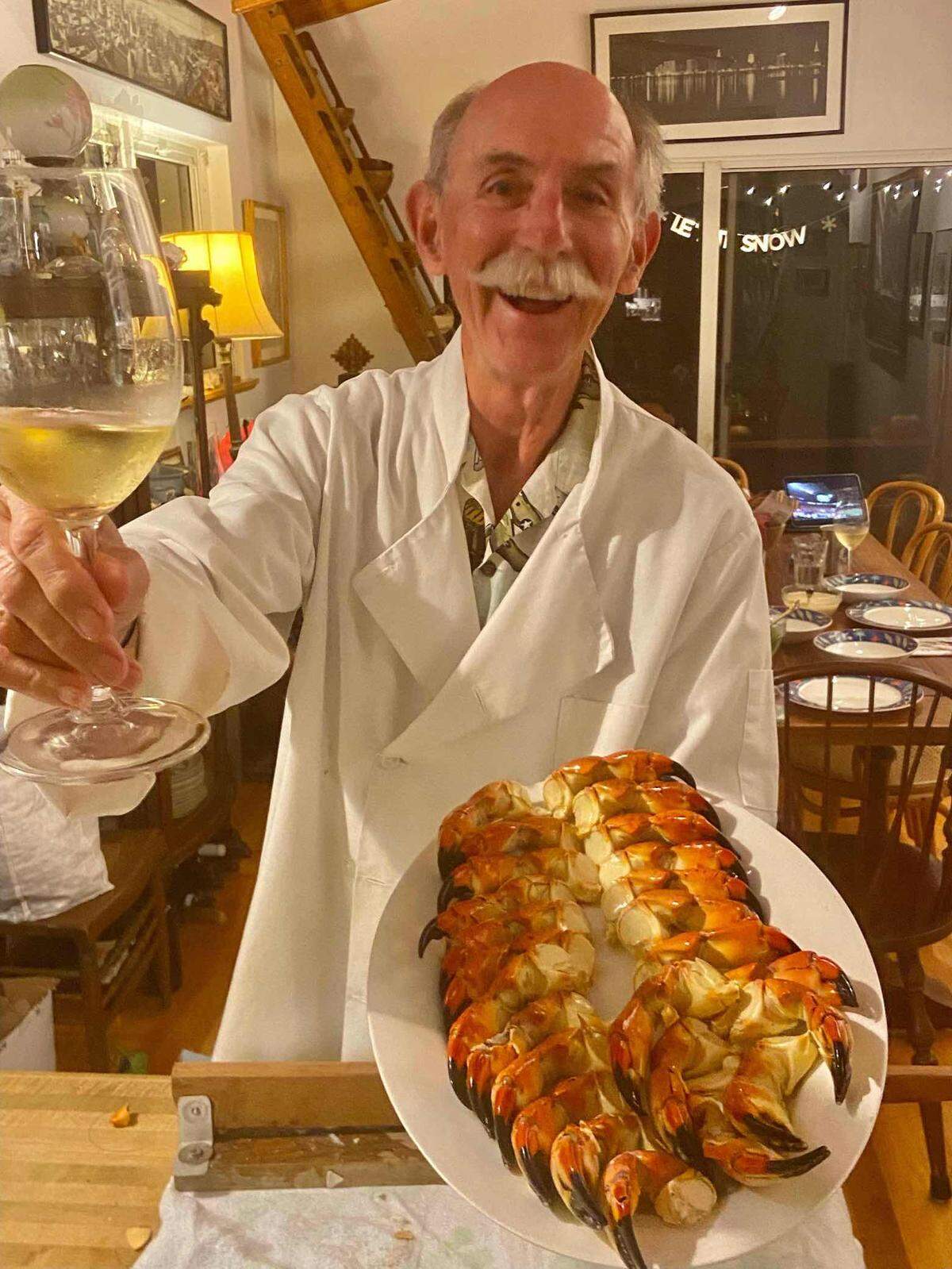 Murry Sill, who loved many things, including eating anything delicious, showed off a platter in this family photo.