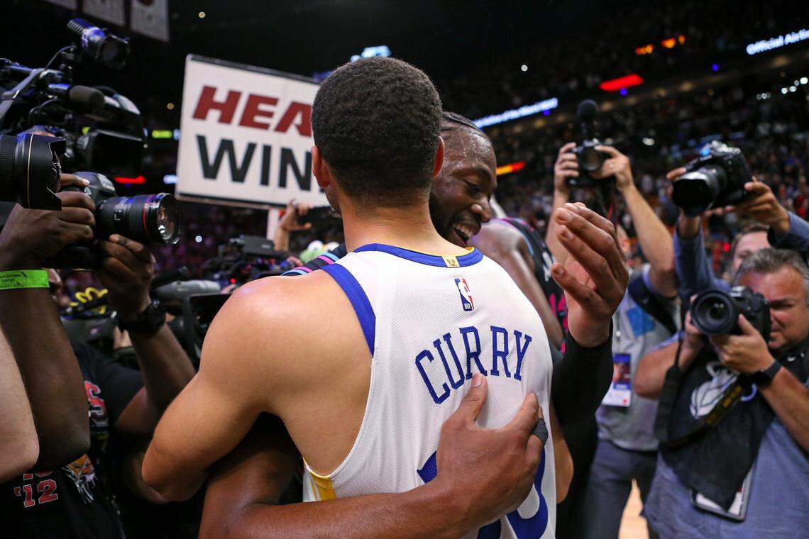 Miami Heat guard Dwyane Wade (3) hugs Golden State Warriors guard Stephen Curry (30) after hitting a three pointer buzzer beater in the fourth quarter of an NBA basketball game against the Golden State Warriors at AmericanAirlines Arena on Wednesday, February 27, 2019 in Miami. Heat won 126-125.