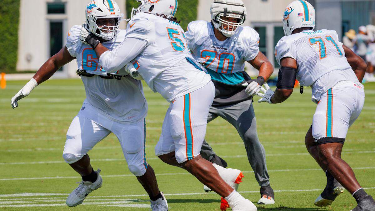 Miami Dolphin’s offensive line runs a drill during Miami Dolphins Training Camp on Monday, July 29, 2024, at Baptist Health Training Complex in Miami Gardens.