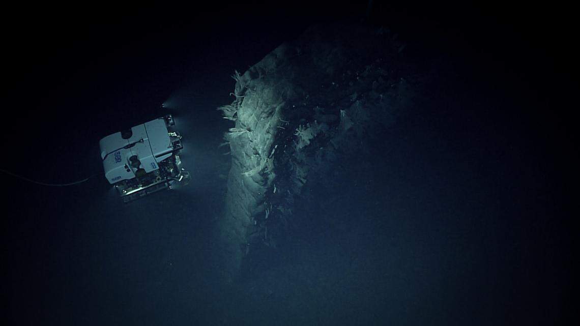The remotely operated vehicle Deep Discoverer encountered a 49-foot-tall “solitary geological feature” while exploring the Pacific seafloor northeast of Kuailhelani on April 22.