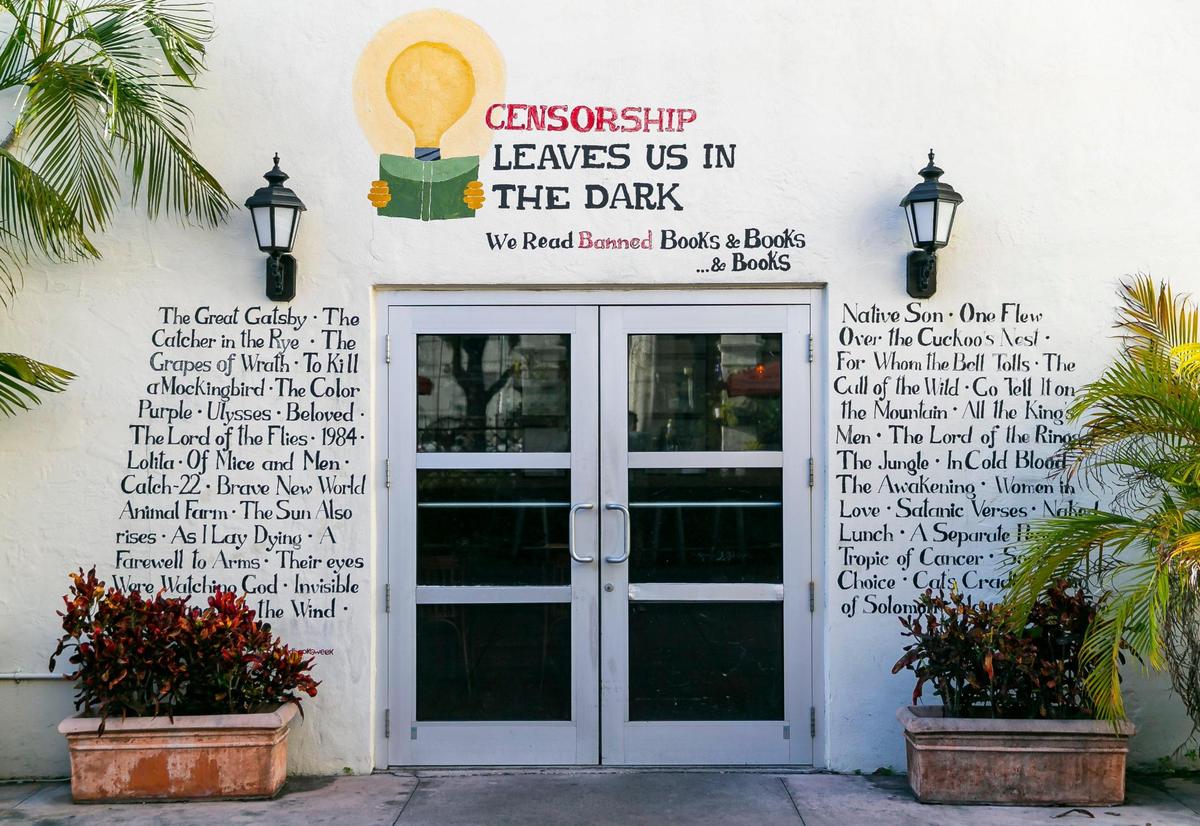 A wall is decorated with book titles at Books & Books in Coral Gables, Florida.