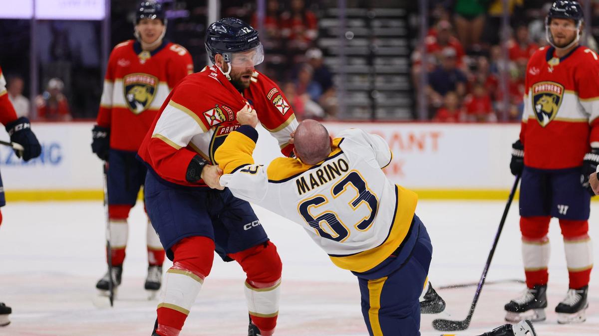 Florida Panthers left wing Jonah Gadjovich (12) fights against Nashville Predators defenseman Kyle Marino (63) during the first period of an NHL preseason game at Amerant Bank Arena in Sunrise, Florida, on Sunday, September 22, 2024.