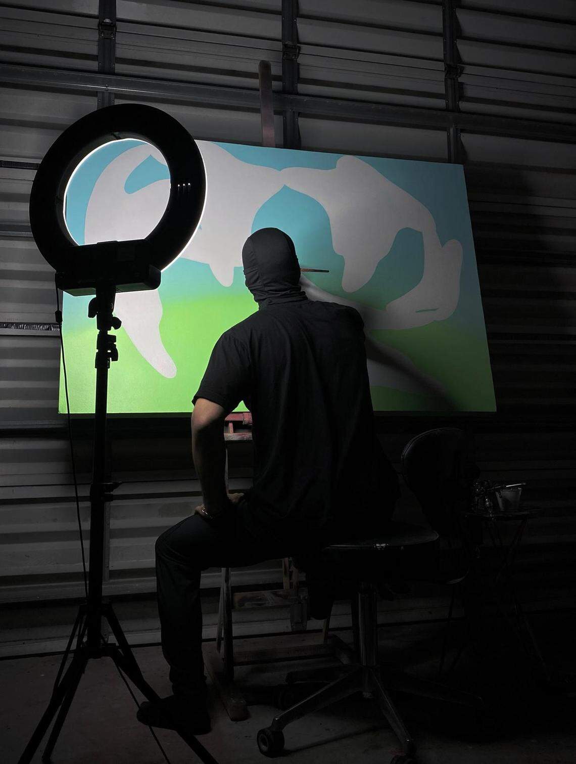 Digital Artist The Miracle Ghost works on painting before the upcoming III Points Festival at Mana Wynwood.