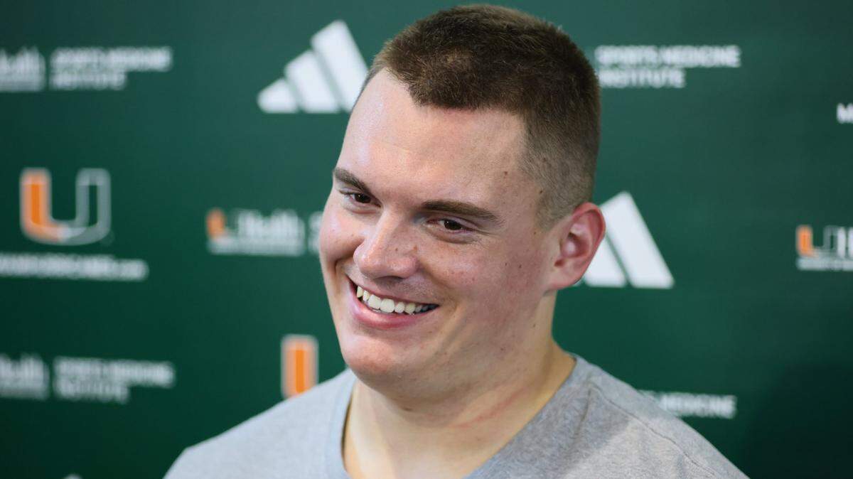 University of Miami ofensive lineman Zach Carpenter (50) talks to reporters after spring practice at the Carol Soffer Indoor Practice Facility at the University of Miami in Coral Gables, Florida, Thursday, March 21, 2024.