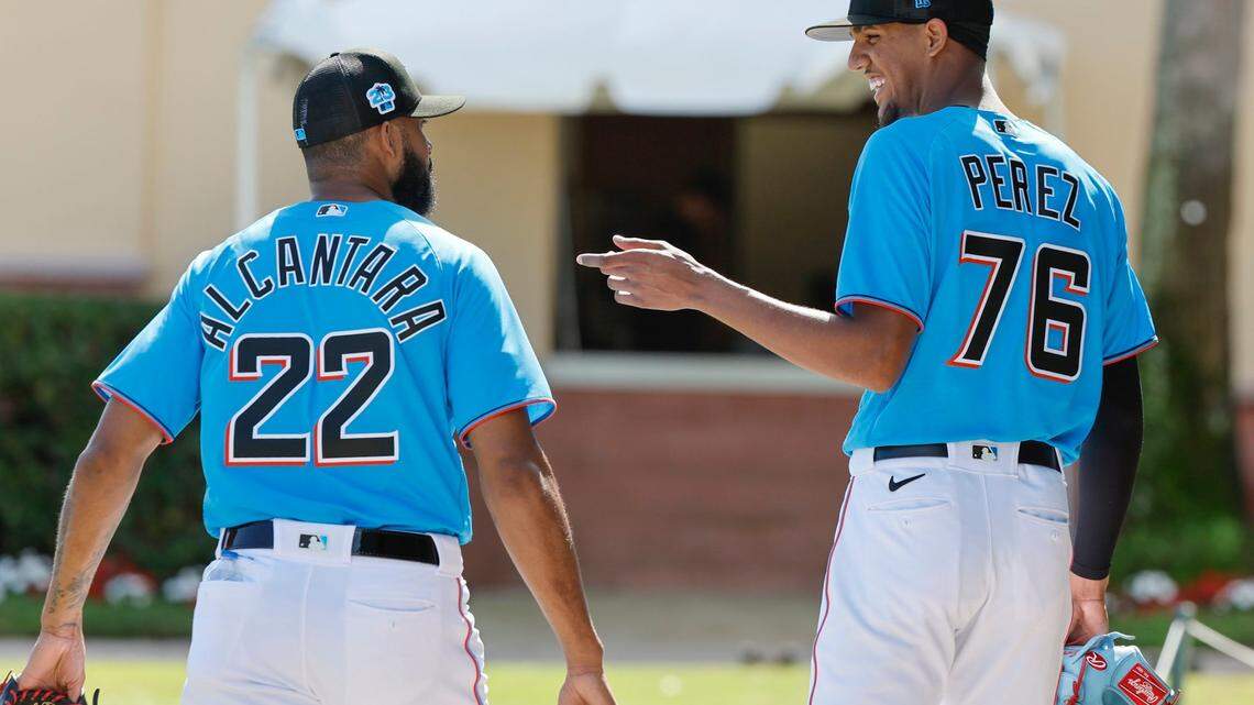 Miami Marlins pitchers Sandy Alcantara (left) and Eury Perez) talk on their way to the clubhouse after a workout at Roger Dean Chevrolet Stadium in Jupiter, Florida on Thursday, February 16, 2023.
