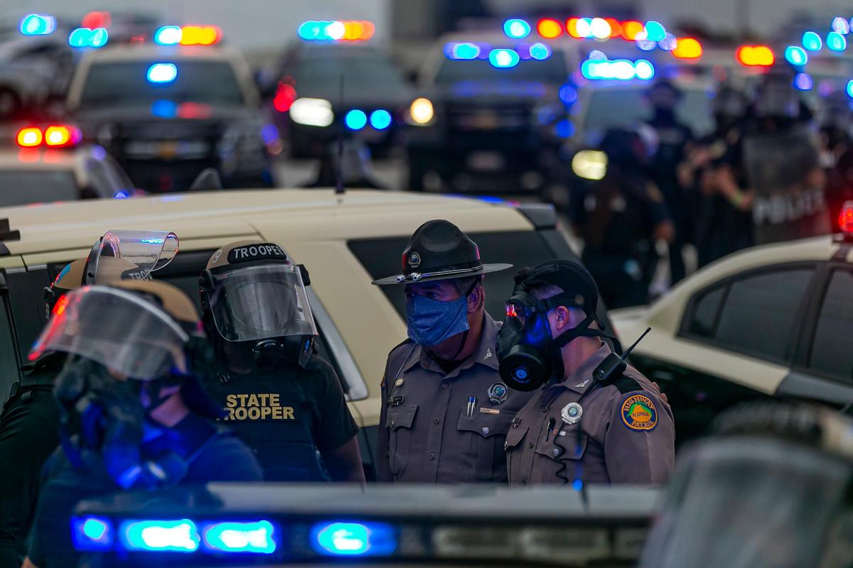 Protesters and Florida Highway Patrol officers meet on one of the ramps of the Julia Tuttle Causeway on Friday, June 5, 2020, during a Justice for George Floyd rally that began in Wynwood.