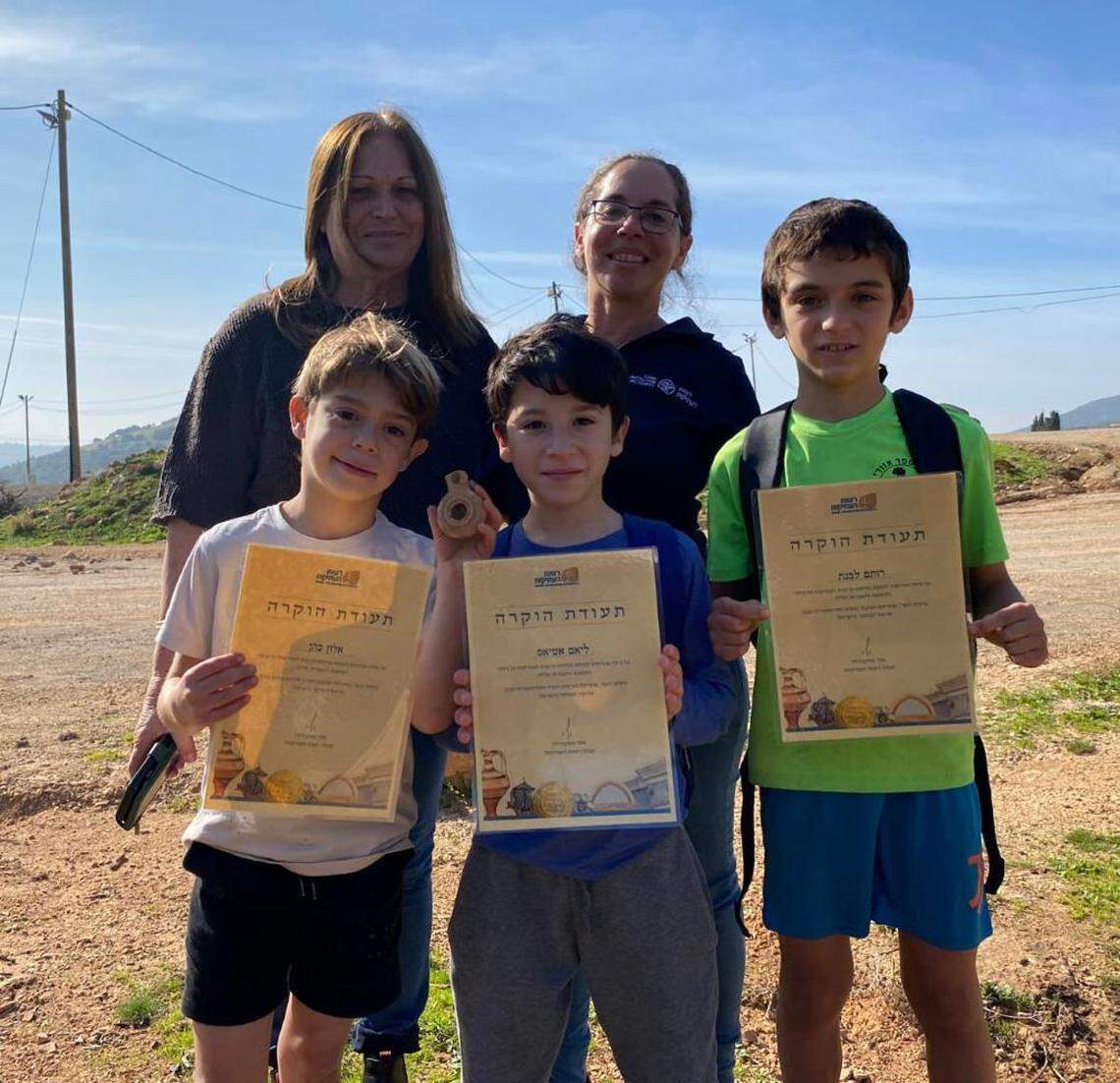 The boys with their certificates of appreciation and the clay candle.