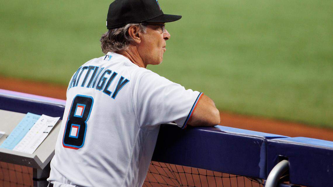 Miami Marlins manager Don Mattingly (8) looks from the dugout during the first inning of a baseball game against the New York Mets at LoanDepot Park on Sunday, July 31, 2022 in Miami, Florida.