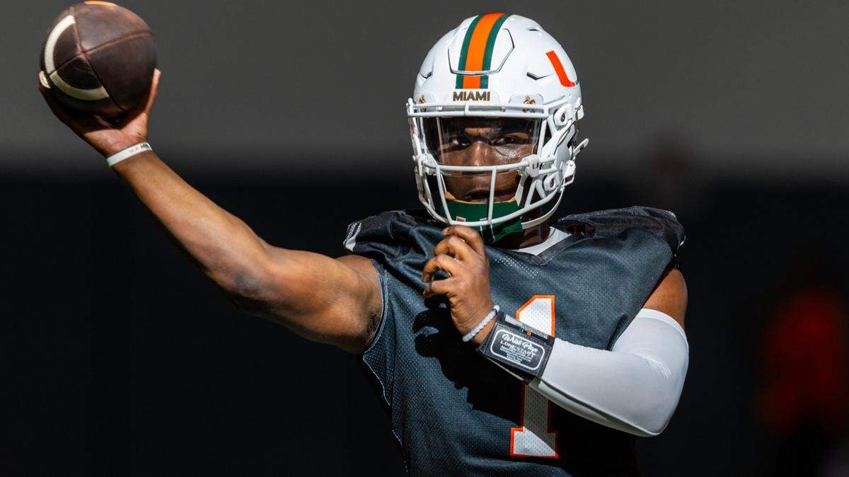 Miami Hurricanes quarterback Cam Ward (1) throws the ball during practice at the Carol Soffer Indoor Practice Facility on Wednesday, July 31, 2024, in Coral Gables, Fla.