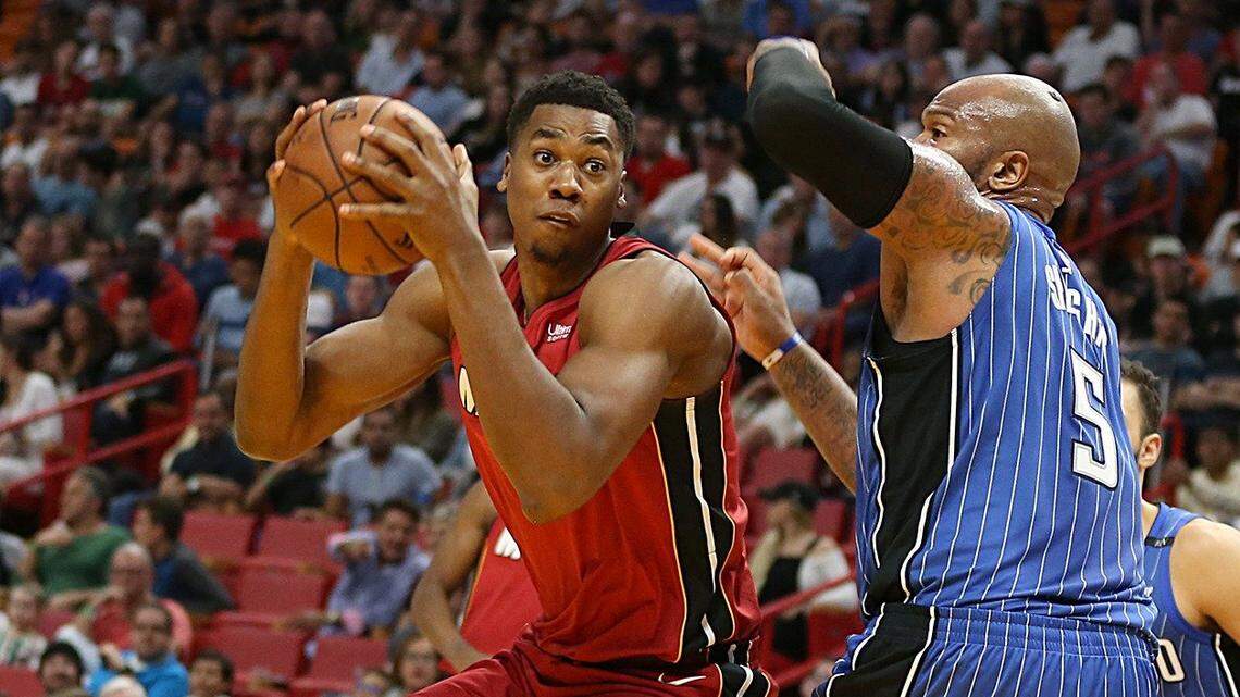 Miami Heat center Hassan Whiteside goes to the basket against Magic forward Marreese Speights in the second quarter of an NBA game at AmericanAirlines Arena in Miami on Tuesday, December 26, 2017.
