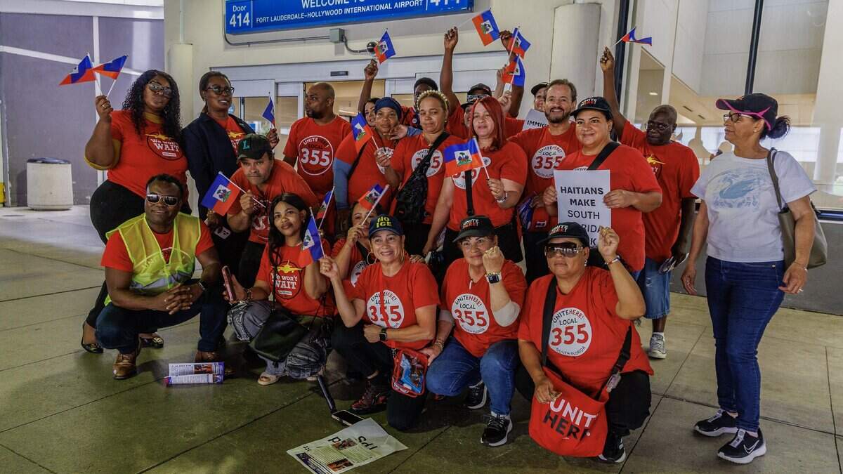 A group of Airport and hotel food and beverage workers with the UNITE HERE Local 355 union, posed foe a pictures after a press conference held at Fort Lauderdale-Hollywood International Airport (FLL) demanding an extension of Temporary Protected Status (TPS) for Haitians, on Friday July 10, 2026.