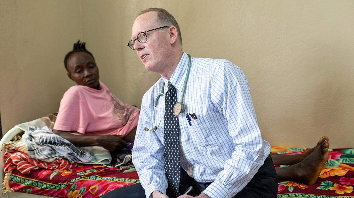 Partners In Health co-founder and chief strategist Dr. Paul Farmer consults on cases for patients like Yie Hawa Missah on July 3, 2019. Missah was suffering from acute onset paralysis at PIH-supported Koidu Government Hospital in Kono District, Sierra Leone.