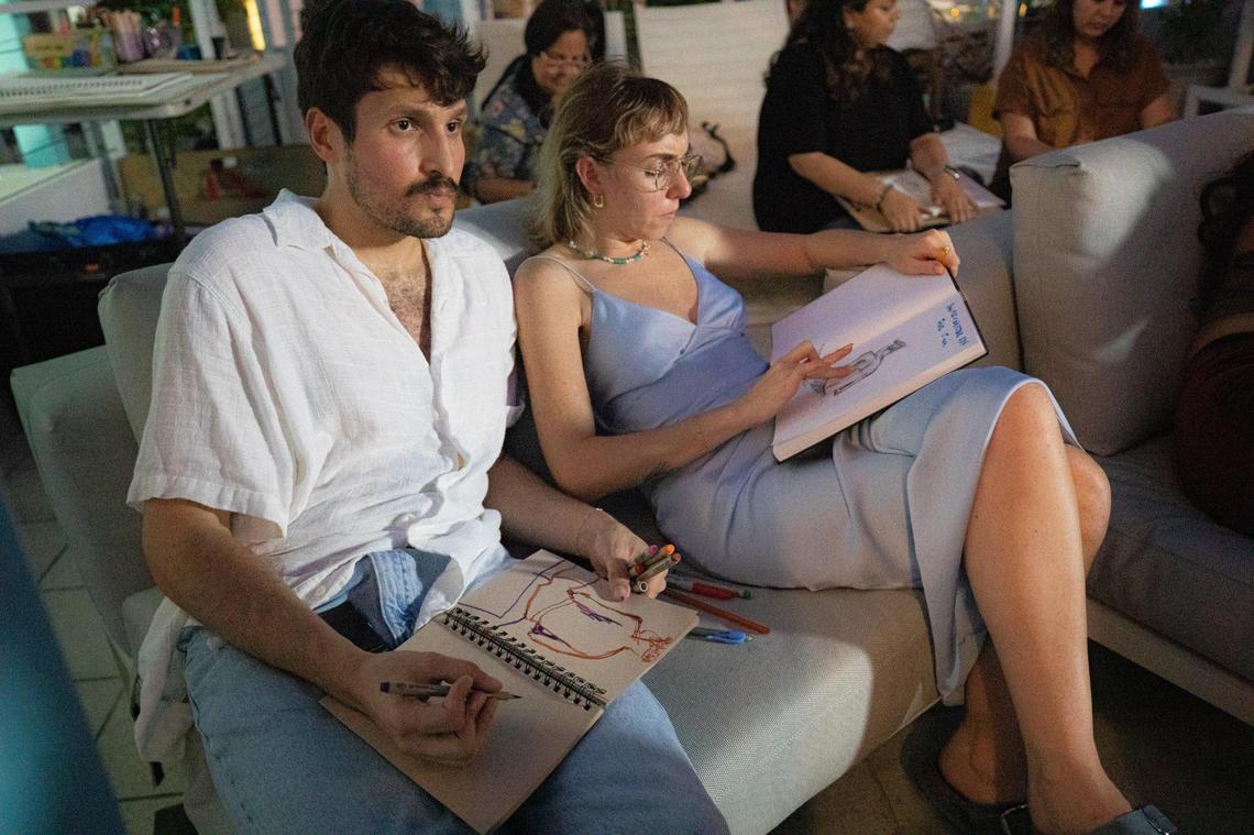 People make figure drawings of artist Mychal Clayton at Hotel Greystone during the Raw Figs Pop Up in Miami Beach, Florida on Wednesday, August 25, 2022.