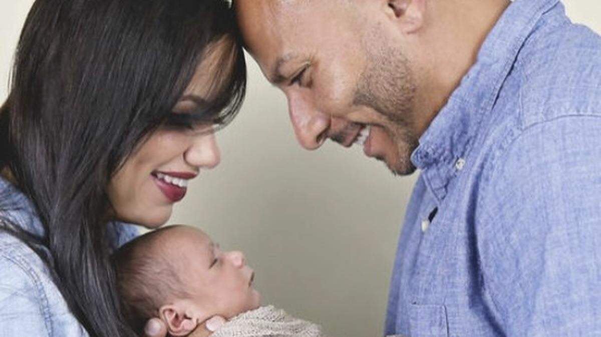 The writer, Janelle Bravo-San Pedro, and her husband, Erick, hold their newborn, Tristan Xavier.