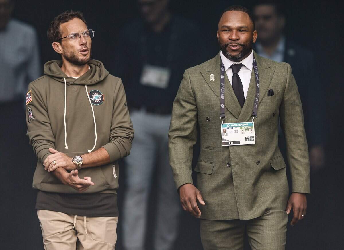 Miami Dolphins head coach Mike McDaniel and General Manager Anthony "Champ" Kelly walk out of the tunnel prior to the NFL football game against the Buffalo Bills at Hard Rock Stadium in Miami Gardens, Florida on Sunday, November 9, 2025.