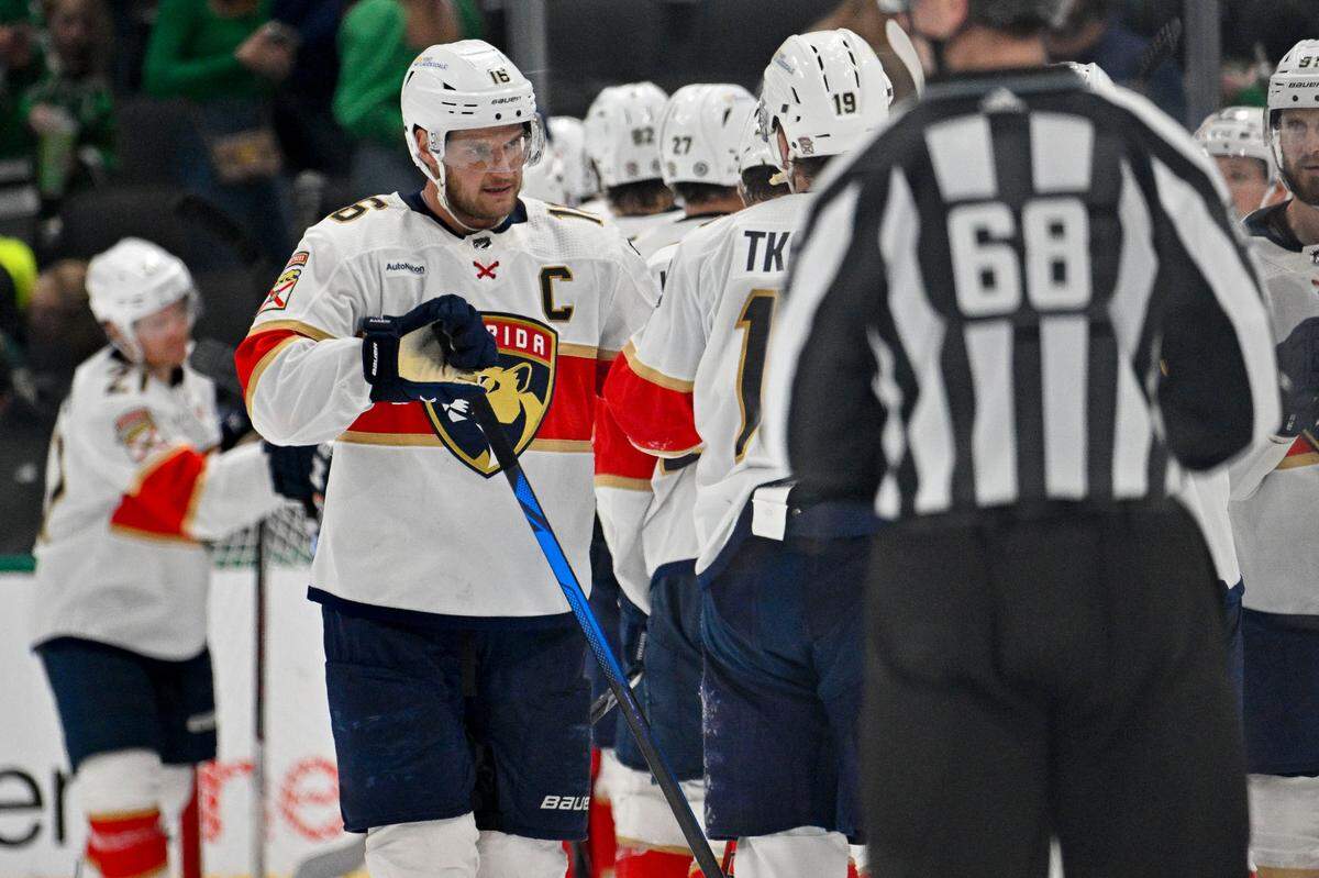 Mar 12, 2024; Dallas, Texas, USA; Florida Panthers center Aleksander Barkov (16) and left wing Matthew Tkachuk (19) celebrates after the Panthers defeat the Dallas Stars at the American Airlines Center. Mandatory Credit: Jerome Miron-USA TODAY Sports