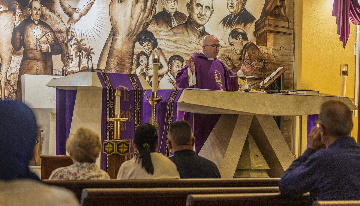 Father Eliosbel Pereira Almaguer, Parochial Vicar at La Ermita de la Caridad, Our Lady of Charity National Shrine, in Miami leads a Mass hours after Cuban leader Miguel Díaz-Canel had confirmed that Havana is in the midst of talks with the Trump administration on Friday, March 13, 2026.