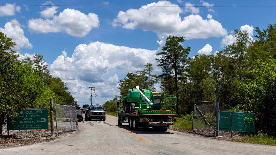 Semi-trailers transport heavy machinery during the construction of the new detention center.