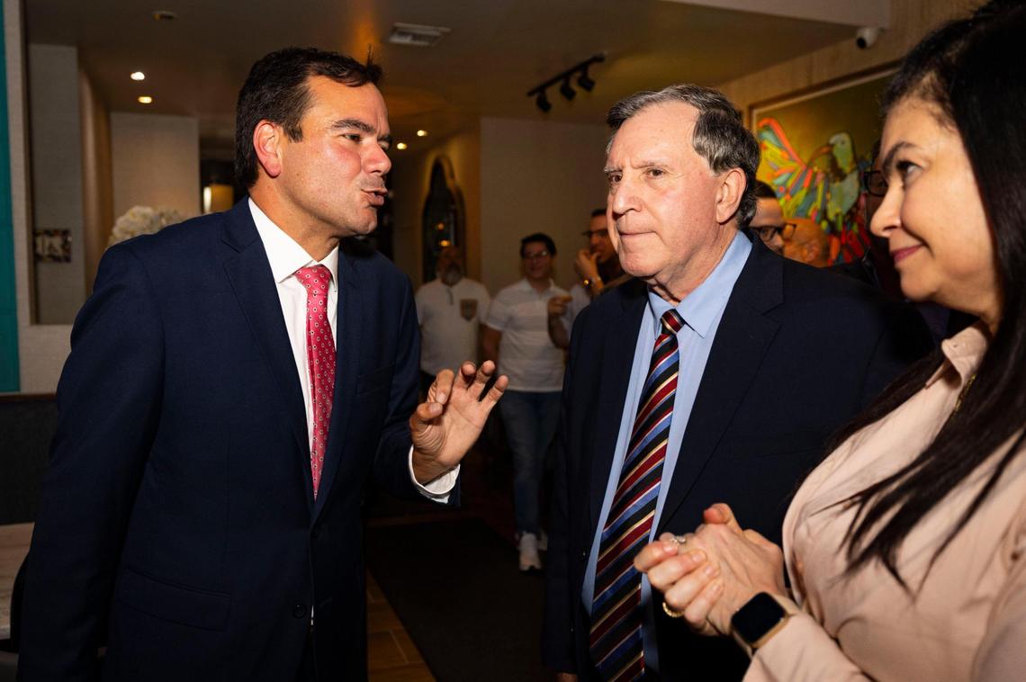 Ralph Rosado, left, talks to Commissioner Joe Carollo and Carollo’s wife, Marjorie, after Rosado’s victory on Tuesday, June 3, 2025, at El Atlacatl restaurant in Miami.