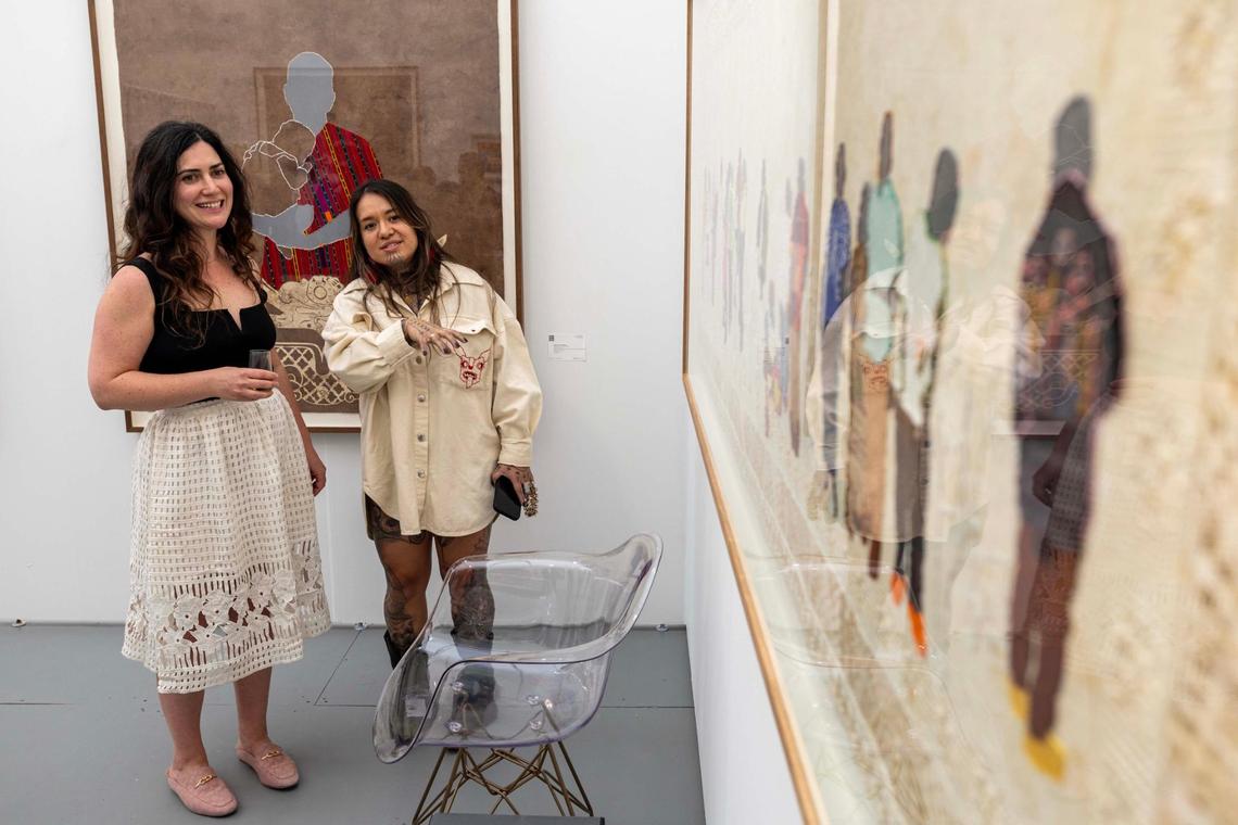 Artist Arleene Correa Valencia speaks with Sarah Michelle Rupert about her piece ‘Aqui/Here’ at Untitled Art Fair for Miami Art Week on Tuesday, Dec. 3, 2024, in Miami Beach, Fla.