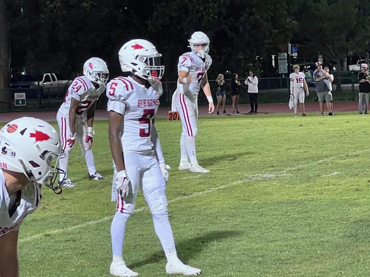 Cardinal Gibbons quarterback Jayden Torres (No. 7, right) passed for 415 yards and four touchdowns and rushed for another score as the Chiefs fell to West Broward 43-39 at Cypress bay High on Friday.