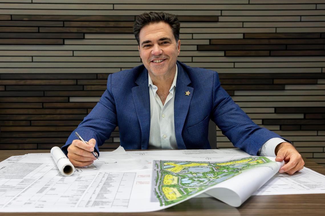 Miami attorney Felix Lasarte is photographed as he holds plans and renderings of proposed expansions to Trump National Doral at PPKS Architecture on Tuesday, Dec. 17, 2024, in Doral, Florida.