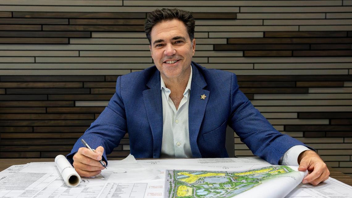 Miami-Dade attorney Felix Lasarte is photographed as he holds plans and renderings of proposed expansions to Trump National Doral at PPKS Architecture on Tuesday, Dec. 17, 2024, in Doral, Florida.
