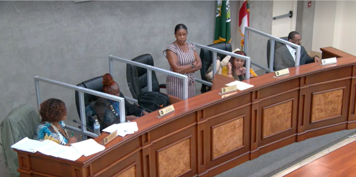 West Park Mayor Felicia Brunson stands with her arms crossed at the May 21 city commission meeting. City Commissioner Katrina Brunson alleges in a recently filed lawsuit that Brunson improperly ends meetings abruptly for political reasons.