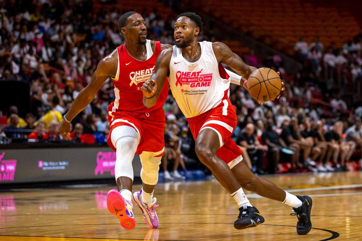Miami Heat forward Haywood Highsmith (24) drives on center Bam Adebayo (13) during the Red, White & Pink intrasquad scrimmage at FTX Arena in Miami on October 3, 2022.