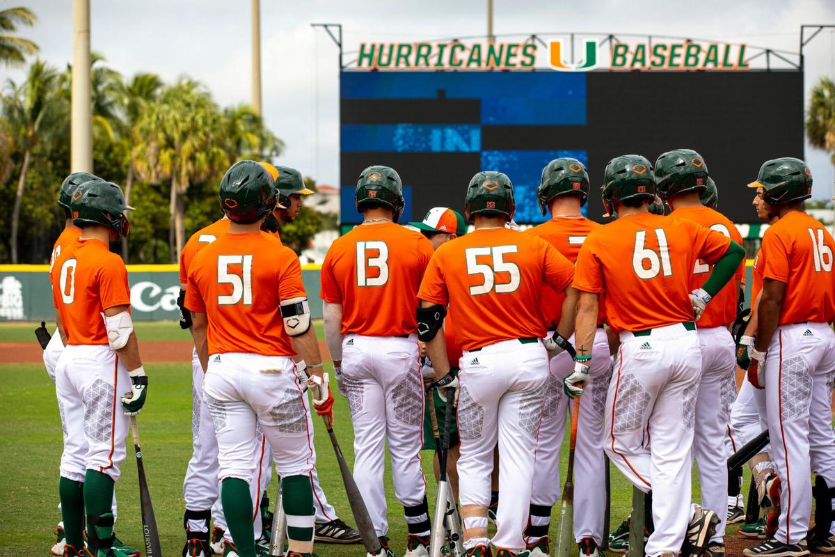 University of Miami baseball players huddle as the first day of preseason practice was underway at Alex Rodriguez Park at Mark Light Field in Coral Gables, Florida, on Friday, January 28, 2022.