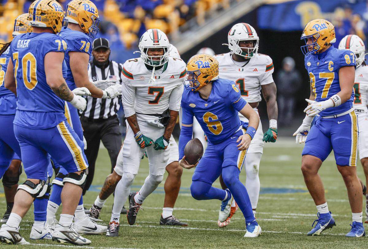 Miami Hurricanes safety Zechariah Poyser (7) reacts after tackling Pittsburgh Panthers quarterback Mason Heintschel (6) during the first half of their NCAA football game at Acrisure Stadium in Pittsburgh, PA, on Saturday, November 29, 2025.