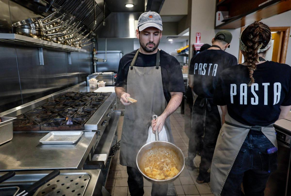 Chef/owner Juan Manuel Umbert sautes an order at Pasta restaurant in Wynwood.