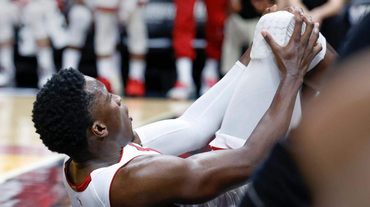 Miami Heat guard Victor Oladipo (4) is injured in the fourth quarter during the game against the Milwaukee Bucks in game 3 of the first-round playoff series at Kaseya Center in Miami on Saturday, April 22, 2023.