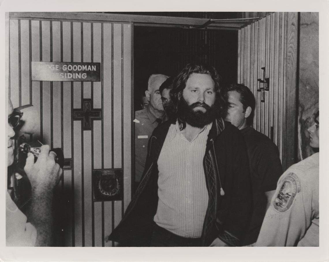 Jim Morrison leaves courtroom. The lead singer of the Doors was on trial, accused of lewd and lascivious behavior, drunkenness, profanity and indecent exposure during a concert at Dinner Key Auditorium in Miami in 1969.