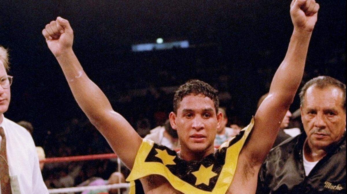 In 1993, Hector ‘Marcho’ Camacho raises his arms after a fight.