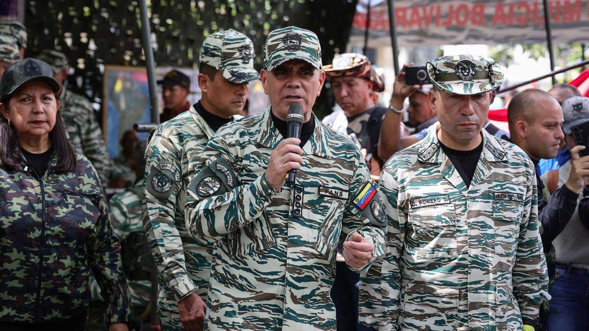 In this file photo, Venezuelan Defense Minister Vladimir Padrino Lopez (center right) who was sacked Wednesday, supervises a training session on military leadership and defense on October 4, 2025 in Caracas. 
